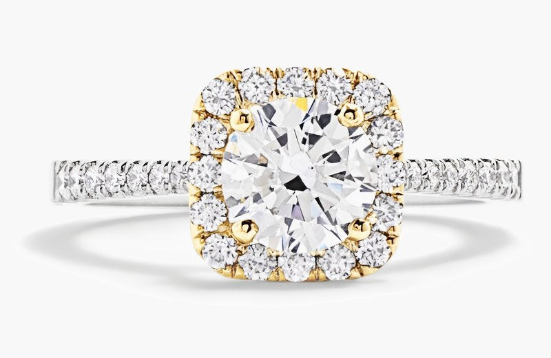 Diamond halo ring in yellow and white gold